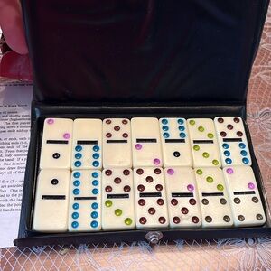 Travel set of 28 mini double 6 color dominoes in snap shut case (box damaged)